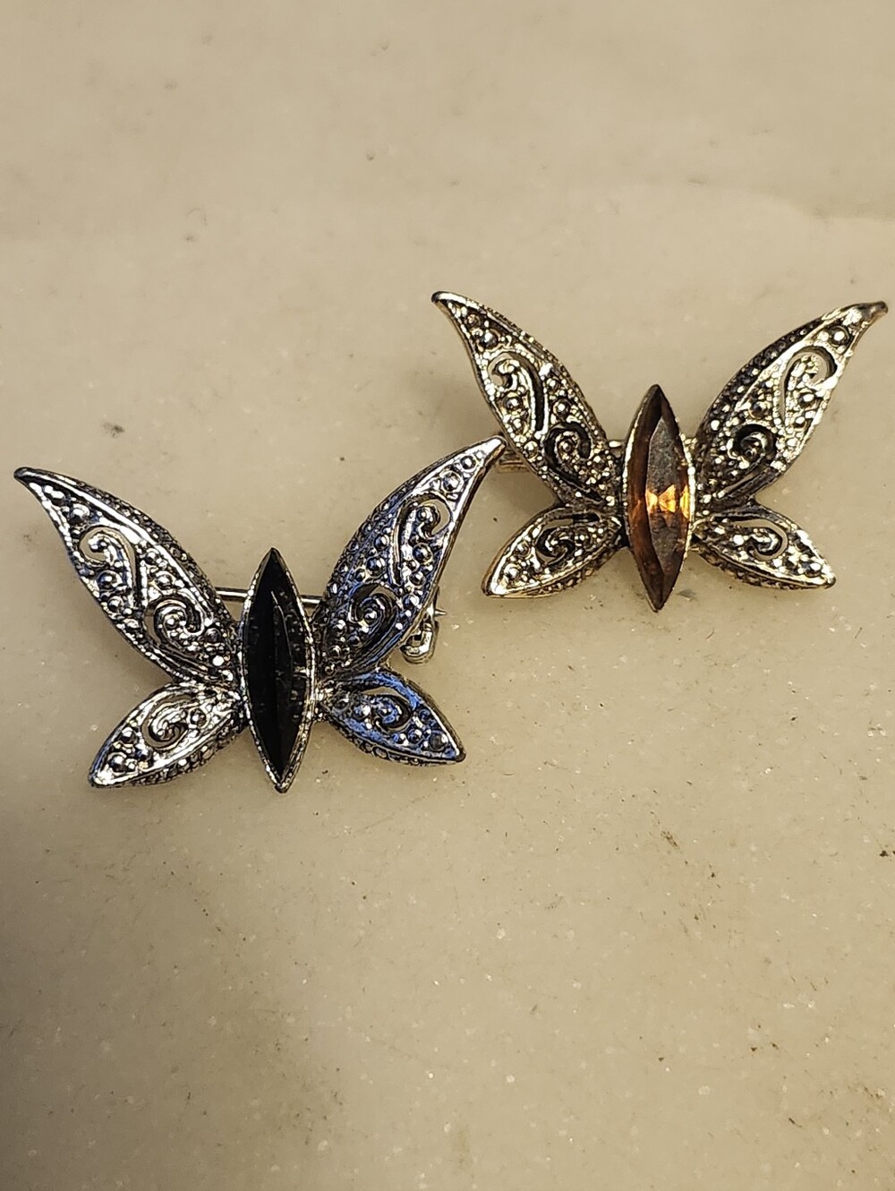 Set Of 2 Silver Filigree Butterfly Brooches - Black and Amber Stones